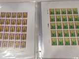 two packages of stamps that are on a table