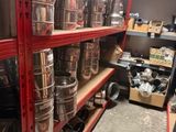 many pots and pans on the shelves in the store