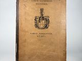 an old book with a picture of a coat of arms on it
