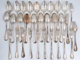 a lot of silver spoons and forks on the table