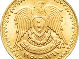 a close up of a gold coin with an eagle on it