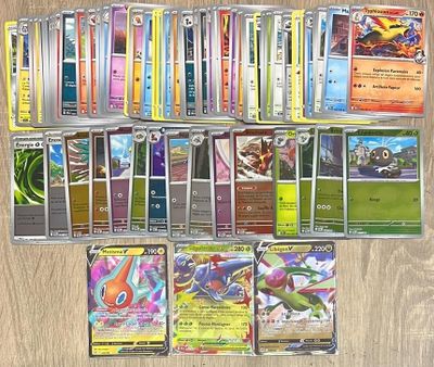 beaucoup de cartes pokemon sur la table