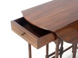a small wooden table with a drawer underneath it