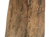 an old piece of wood with holes in it on a white surface