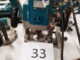 two electric tools on a table with a price tag on it