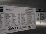 a sign on the side of a stainless steel refrigerator