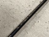 an image of a close up of a baseball bat on the ground