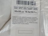 a label on the back of a white shirt