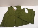 green jacket and pants on a white table with tags on them