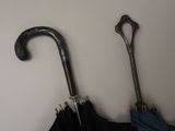 two umbrellas hanging on the wall next to each other
