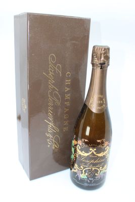 a bottle of champagne sitting next to a box