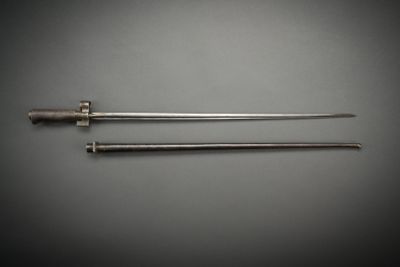 a pair of metal tools sitting next to each other on a table