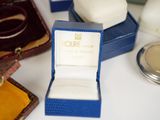 a box with a ring inside of it on a table