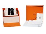 an orange box with a watch inside of it