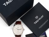 tag heuer watch in a gift box with a credit card