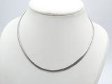silver plated necklace on a mannequin neck with a white background