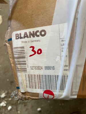 a box with a price tag on it sitting on the ground