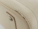 the back of a white suitcase with two handles and a zipper
