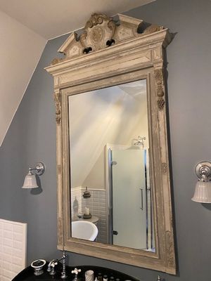 a bathroom with a sink and a mirror on the wall