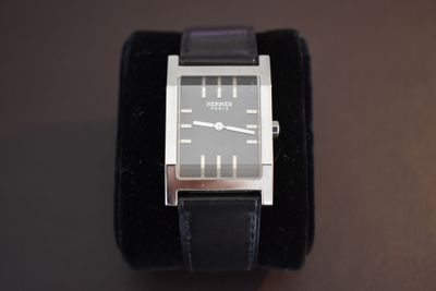 a watch that is sitting on top of a velvet case