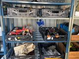 many different types of tools on the shelves in the garage