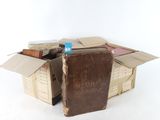 a cardboard box that has some books inside of it