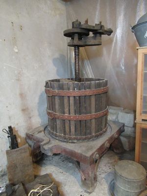 a wooden bucket sitting on top of a table next to a bucket