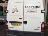 a white van that is parked in a garage
