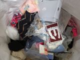 a pile of clothes and other items in a plastic bag