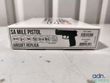 a box with a gun on it sitting on a table