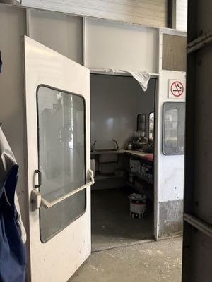 a man that is standing in front of a door