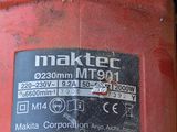 a picture of a red machine with a sticker on it ' s side