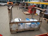 a metal cage with a bunch of water bottles inside of it