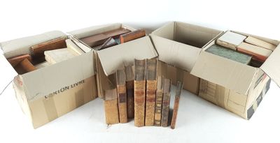 boxes of books are stacked on top of each other on a white surface