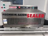 a machine that is sitting on a conveyor belt