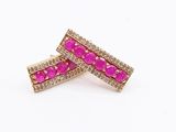a pair of pink and white diamond earrings on a white background