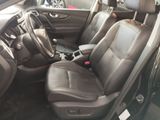the interior of a car with two leather seats and a steering wheel