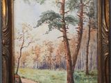 une peinture à l'huile d'un chemin dans une zone boisée avec des arbres