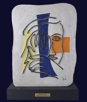 painting of a woman ' s face on a white and blue plaque