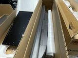 many boxes of electronic equipment sitting on a table