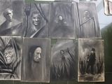 several black and white pictures of people on a wall in a bathroom