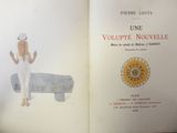 an open book with a picture of a woman on a bed