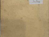 an old piece of paper with writing on it sitting on top of a table
