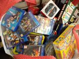 a basket full of video games and games on the table