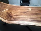 a wooden table that has been made to look like it is in the shape of a wave