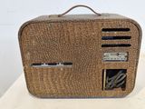 an image of a brown suitcase sitting on top of a white table