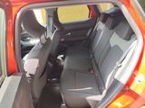 the interior of a car with the door open and the passenger seat down