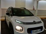 a white citrole parked in a parking garage