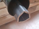 a black pipe that is sitting on top of a table