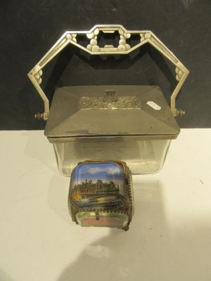 a silver box with a picture on it sitting on a table